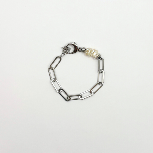 Schakelarmbandje met parelschelpen