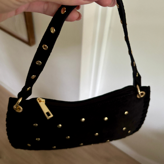 Suède tas met studs